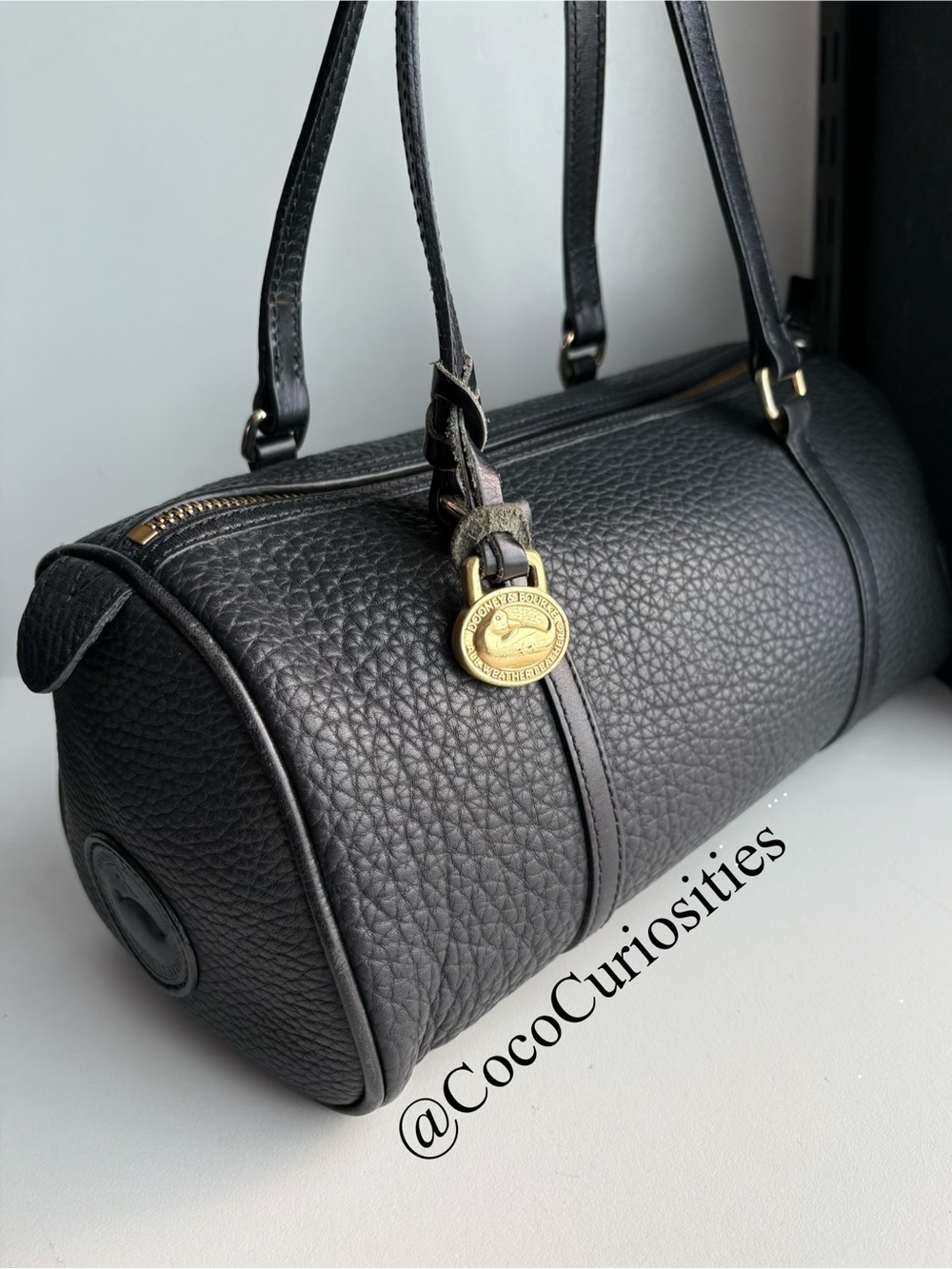 Dooney and Bourke awl  pebbled leather barrel bag